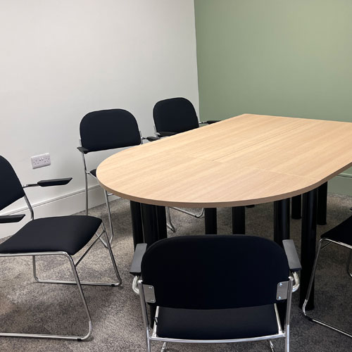 Booth Room - a small meeting room seating 6 at a table